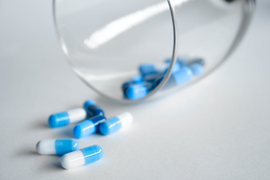 pill coming out of a glass