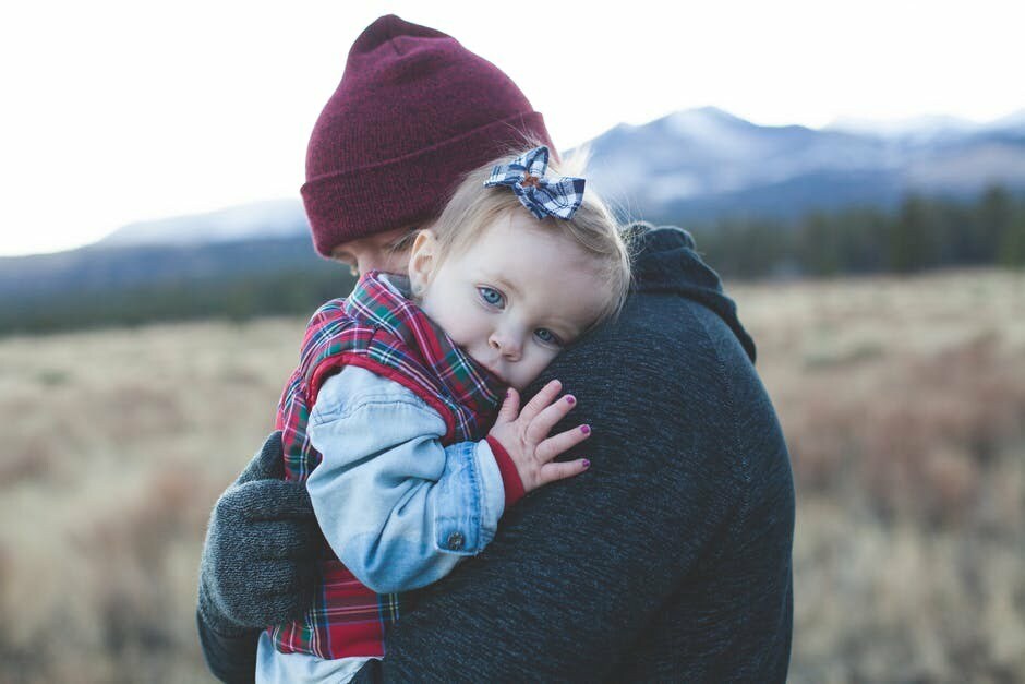 a man holding his child