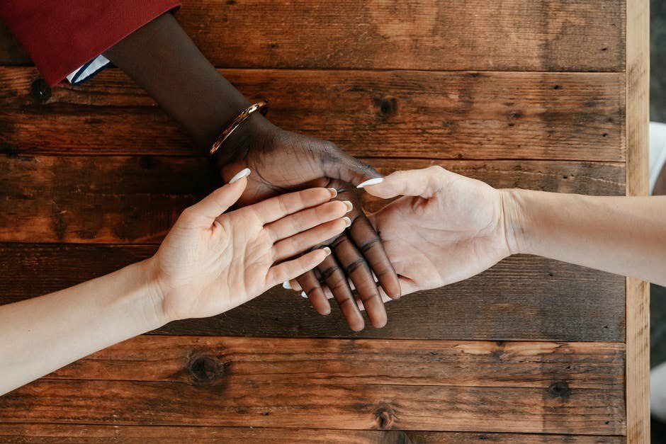 hands open on a table to show support for therapy