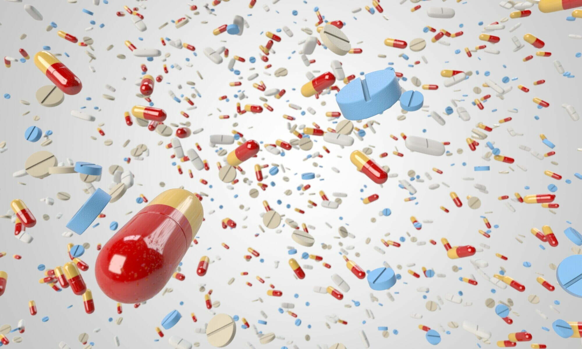 A group of pills and capsules representing prescription addiction