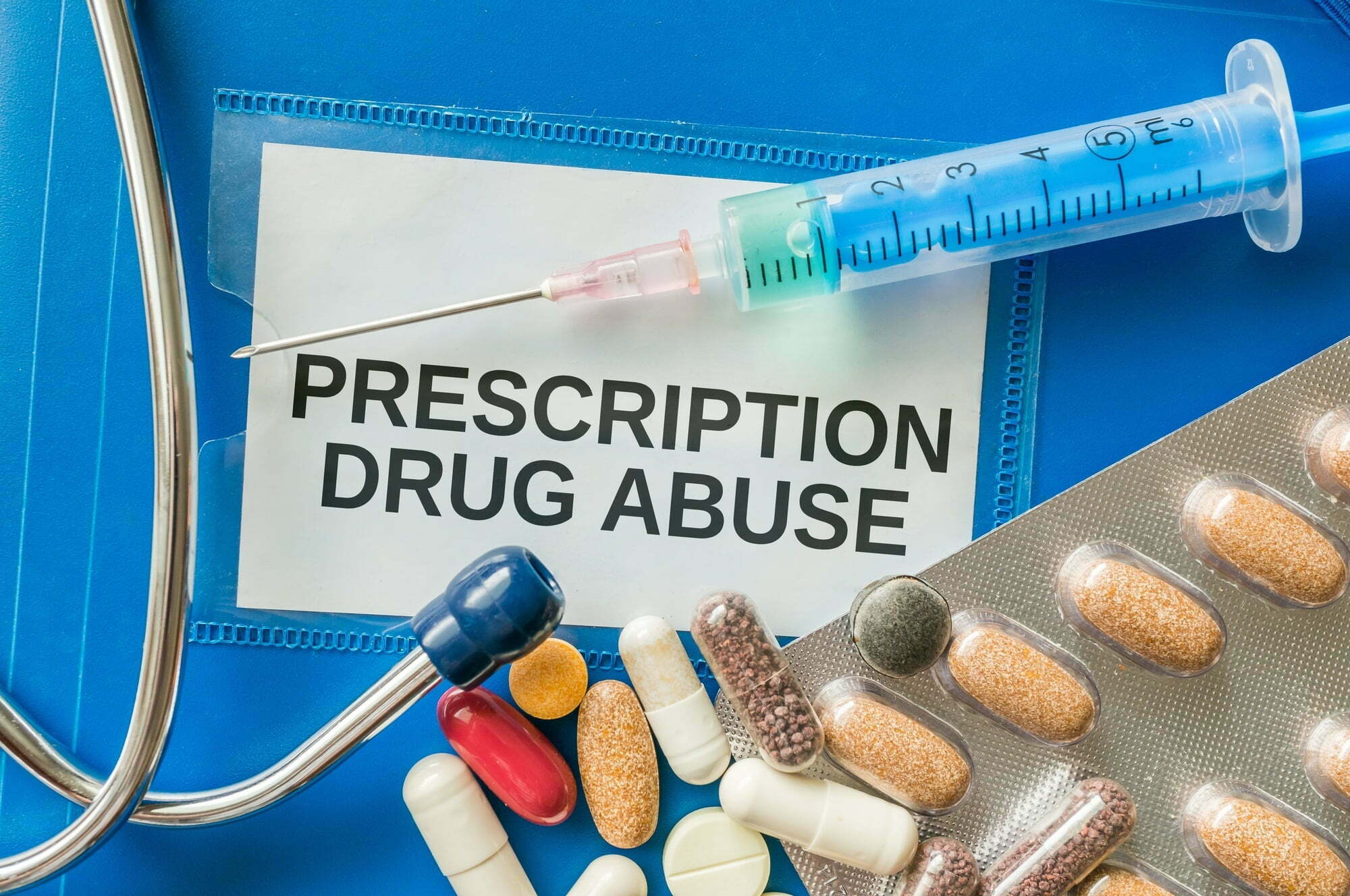 Prescription drug abuse concept. A lot of pills and drugs around