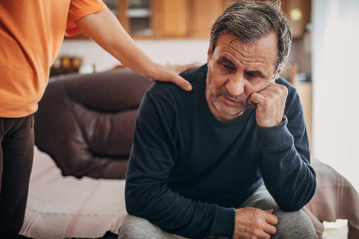 A man being consoled